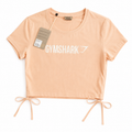 Gymshark peach cotton top with straps Around waist.