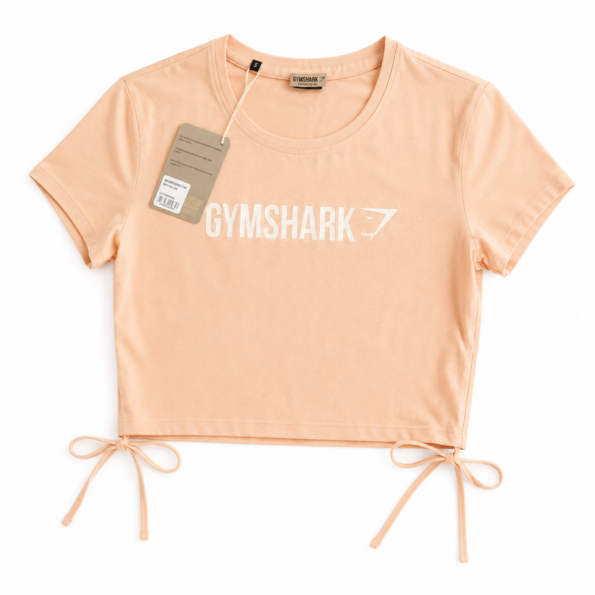 Gymshark peach cotton top with straps Around waist.